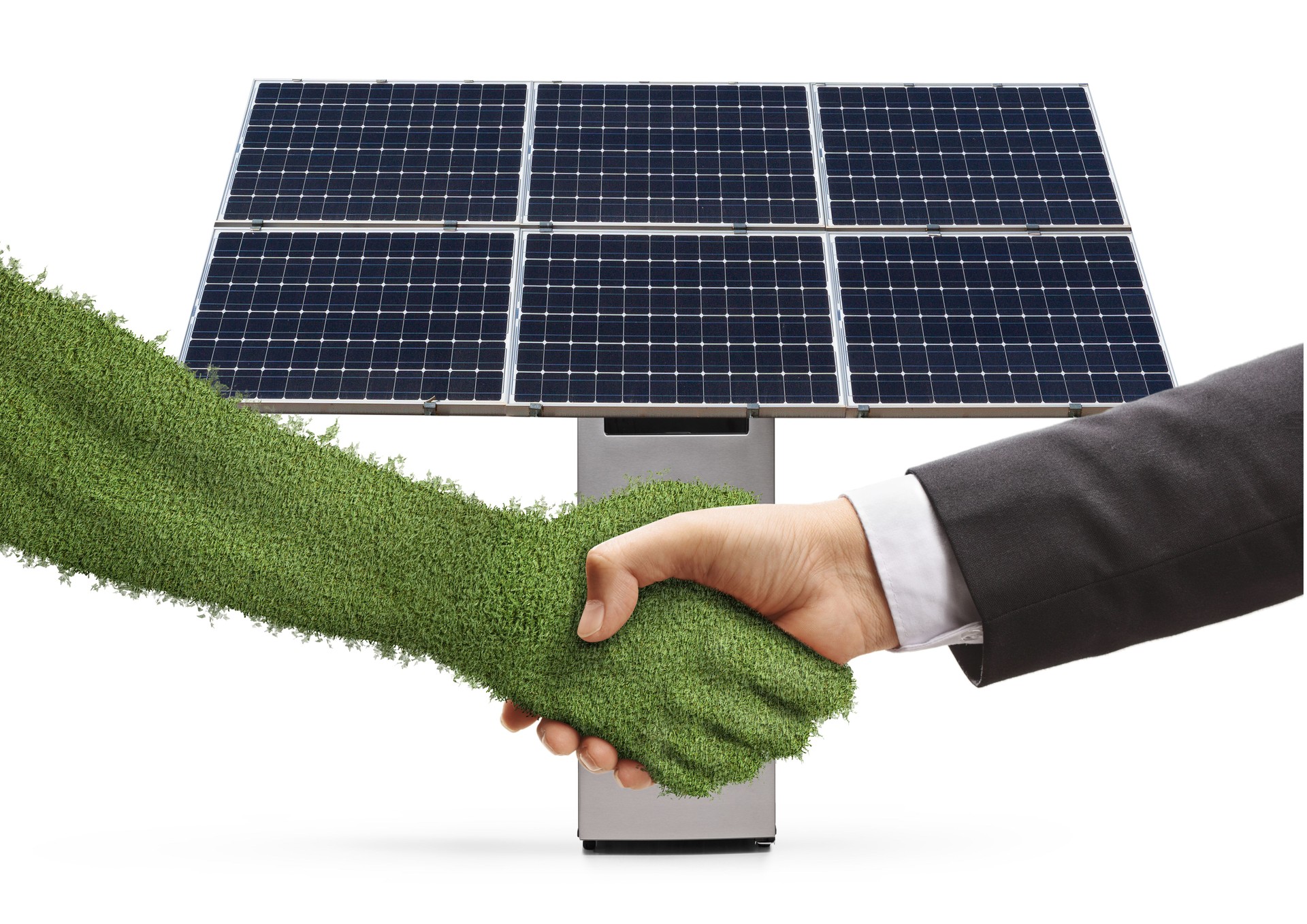 Businessman shaking hand with a green grass hand in front of a photovoltaic